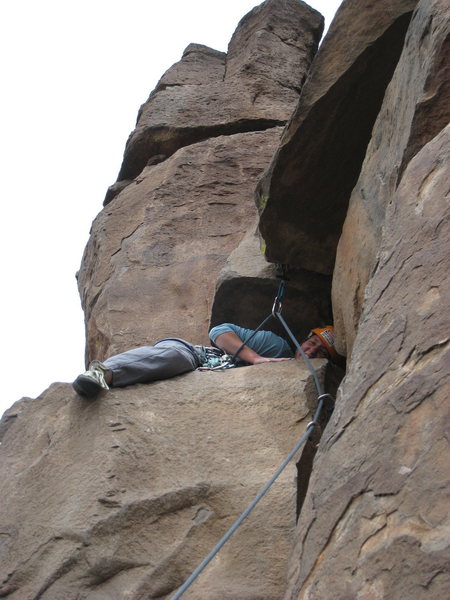 Courtney P., taking a bit of a rest after pulling through the crux.