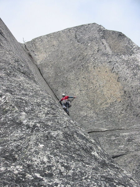 Starting the third pitch corner. This is where the crack is the widest and the most flared. Fortunately some stemming, palming and careful pulling on the flared lip of the crack will get you to the bolt. After the bolt the crack starts to accept more confidence-inspiring gear.