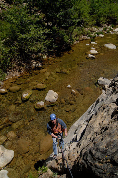 David Hoffberg demonstrates the water start, an often necessary hanging belay at the start of Pipe Cleaner.