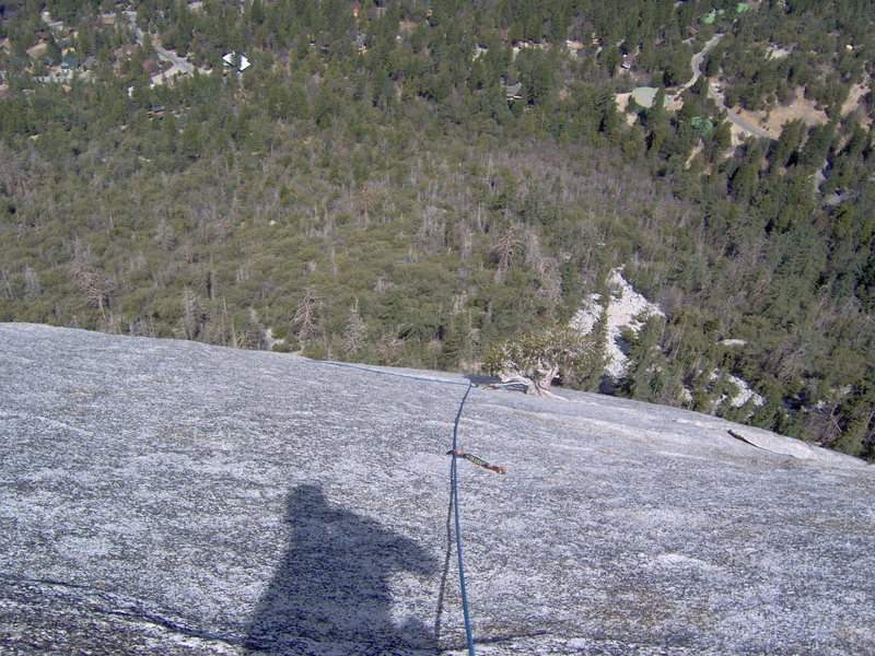 A look down at the polished granite (and my irregular shadow) of the slabby left finish.