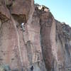 George Perkins on the unknown dihedral left of Putterman Cracks. Courtney Porreca on the belay.