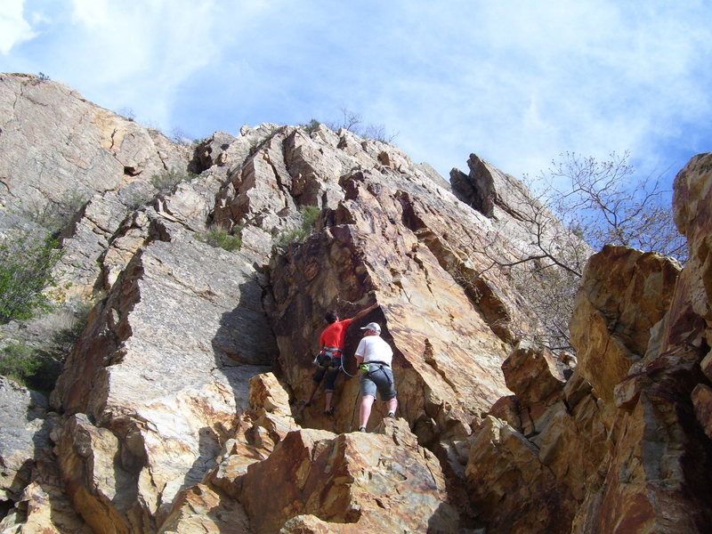 Tristan getting started. The climb is steeper than this photo shows. You can also see the routes on the right side pretty clearly as well.