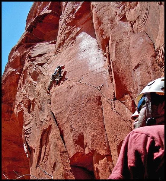 Finishing the crux of the second pitch of Arch Enemy, while Chris belays & soaks up the scenery on his first visit to Sedona. An exciting and very exposed pitch. Photo by Manny R.