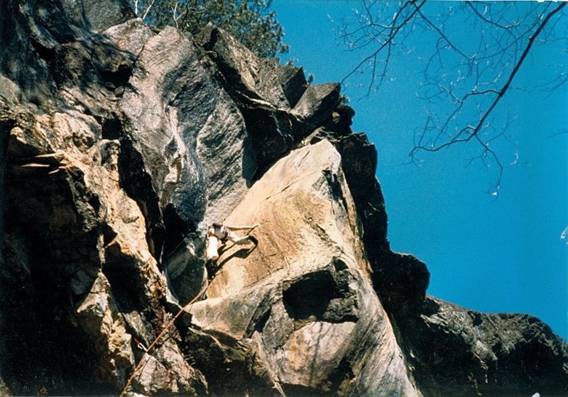 First assent? Climbed on gear and pins (the pins keep falling out). Note the lack of bolts and draws on the crag. Tom Armstrong climbing.