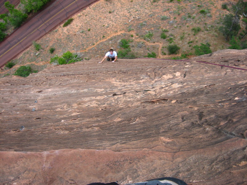 Noah as a second follower on the 2nd pitch. Bolted hangers can be seen on left where slings were removed by the first follower. Photo taken 24 May 08 by the first follower standing on the small and only ledge of the pitch, about 20 feet below the anchors.