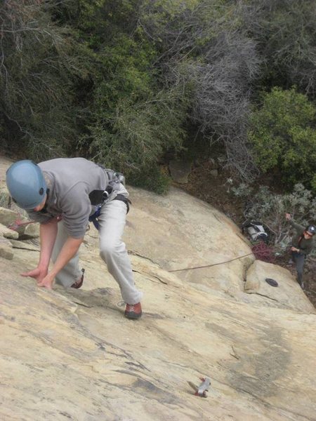 Tom Hall putting a little lieback into it. P1 of South Face.