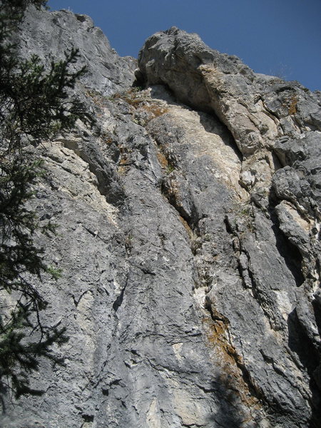 Crack route just to the right of Wavey Gravey: Iraqy Cracky 5.9, 45 ft, ascends the crack after a bouldery start with no pro. Chain Anchors can just be seen at top of climb.