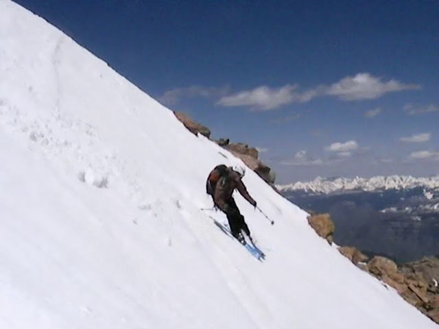 Austin Porzak skiing off the summit of Mount of the Holy Cross