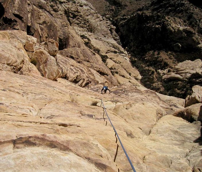 Looking down at the upper slabs. The climbing in this section is easy, but protection and anchor opportunities are limited.