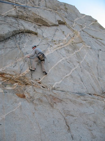 Bryan starting the crux traverse on Cragganmore (5.9+), Crystal Crag.