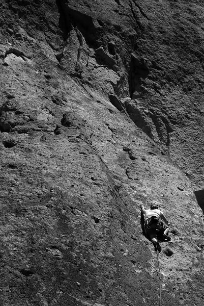 Sarah on lead reaching for another great big golf-ball knob, 3/4 of the way up Dancer, 5.7, Smith Rock.