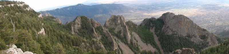 Panorama of Upper La Cueva Canyon with The Thumb to the right.