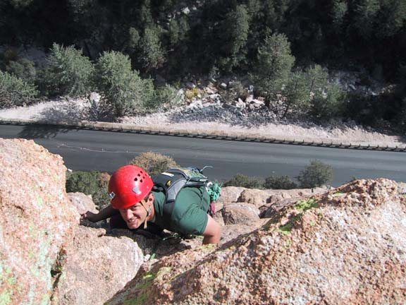 Kelly Mathis topping out on the Standard Route. Lemmon Highway visible below.