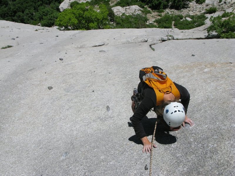 Maura climbing the slab to the belay after "The Hook".