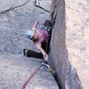 Friend and climbing partner Kat A. follows 'Cosmosis' (sandbag 5.9) on Bell Buttress in Boulder Canyon. Photo by Tony Bubb, 6/08.