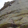 Jon moving his way towards the roof crux. 