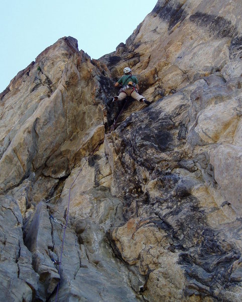 Pulling the juggy hang to the ledge. The chains are to the right. You can lower from there, or you can continue to the top in one pitch.