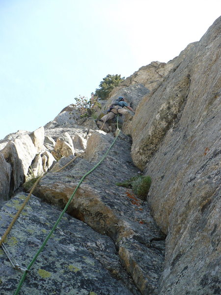 Climbing the 5.6/7 dihedral on our 3rd pitch. Guides Wall, Storm Point, GTNP, WY.