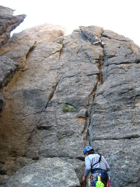 Trying to figure out how to best traverse over to the belay ledge... Actually this turned out to be a very nice, well protected, fun to climb way to get up there. Alas we were forced down after getting to the ledge by a setting sun and weak dispositions. Next year... Photo Aaron Costello.