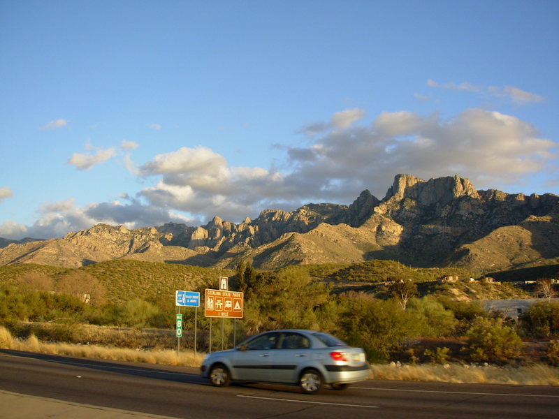 Catalina S.P. from the main road. Leviathon is the large face above the signs. Wilderness Dome is the one above and behind it. Table Mtn is the big'n on the far right.