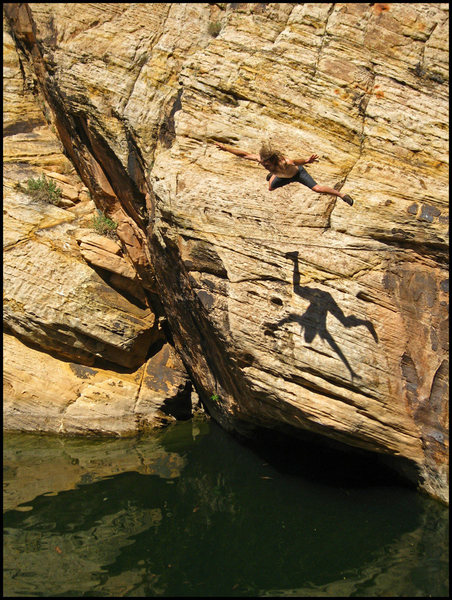 Jumping in after sending a short but sweet DWS problem near the lunch spot. Check out the shadow! <br>
The overhanging crack up dark rock on the left is great, and the low roof below me is a hard tread-water start. Photo by Brenda O.