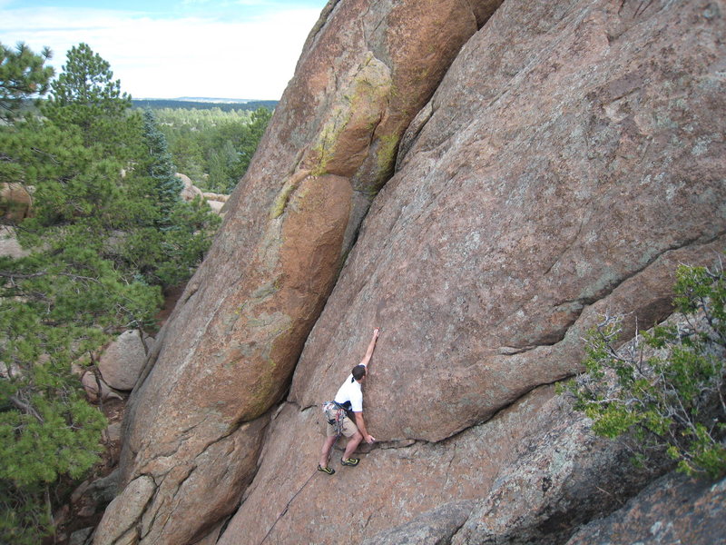Reaching up to clip the 4th bolt on <em>Gila Monster.</em> First route/first time at TP! GREAT stuff. July 26, 2008. Photo by G. Perkins.