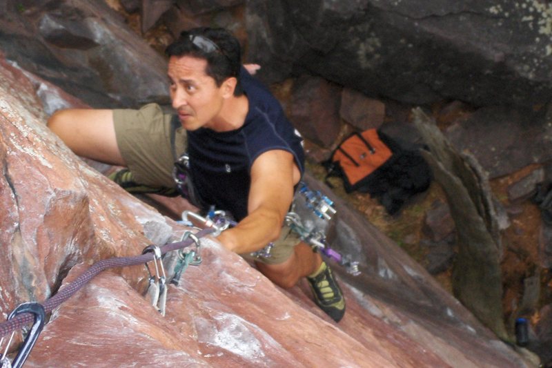 Climbing through the crux on Upper Diagonal 5.9 at Devil's Lake, WI.