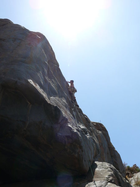 Rebecca Manley finishing up the lead of Suzie's Wild Ride, just as the sun starts to spill over the crag at noon. Time to find shelter...