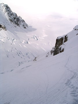 Looking back down towards the crevasse field as the route begins to climb the left side of the basin
