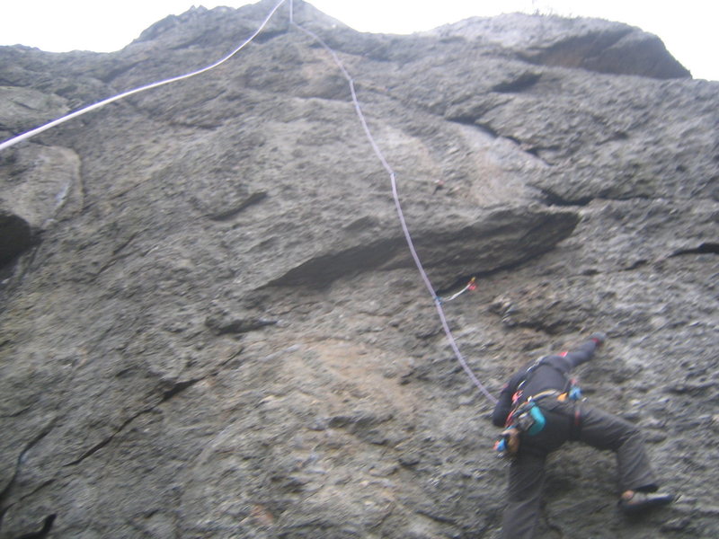 Vertical... Me cleaning the climb. once above the overhang, you can climb anywhere on the face.