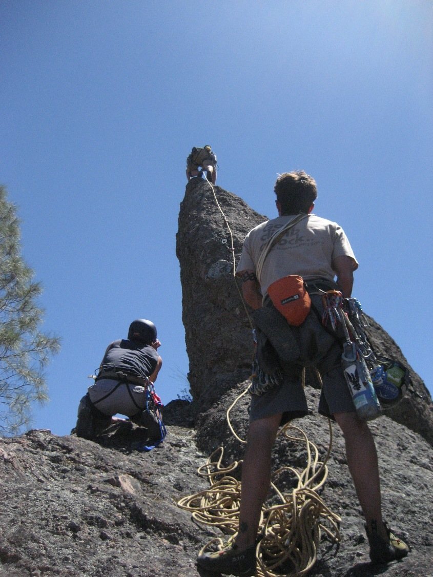 Jeff leading the arête to rap rings on great rock and awesome exposure