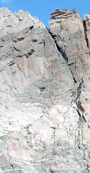 The First belay is right in the corner of the roof where the rock changes from light to dark.