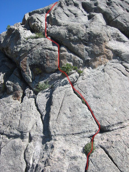 The route for Summer Breeze. (some pictures show people taking the crack to the right of the pine tree, so maybe I am wrong about taking the left one) Also, we belayed where the guy is standing rather than by the pine tree. This allowed for more rope on the next pitch to the top.