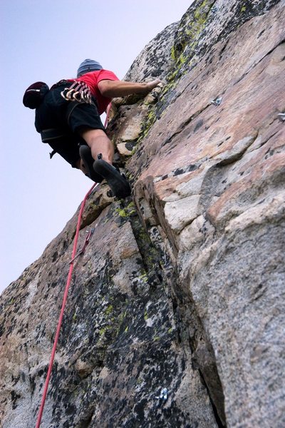 Moving through the tricky section that gains the slab on Up The Junction, 5.10a