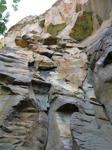 No Feelings goes up to the highest roof on the left. There are excellent jugs that go straight out the center of this giant, chockstone roof.