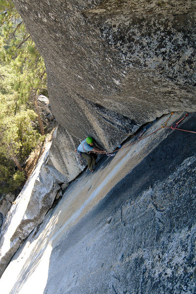 Rob Chaney cleans the Last Dihedral, at Dome Rock. <br>
<br>
This portion of the route is protected by a single compression bolt as well as large gear that is placed atop detached flakes or inside a moss-choked crack (very sketchy). If only it were as clean as it looks.