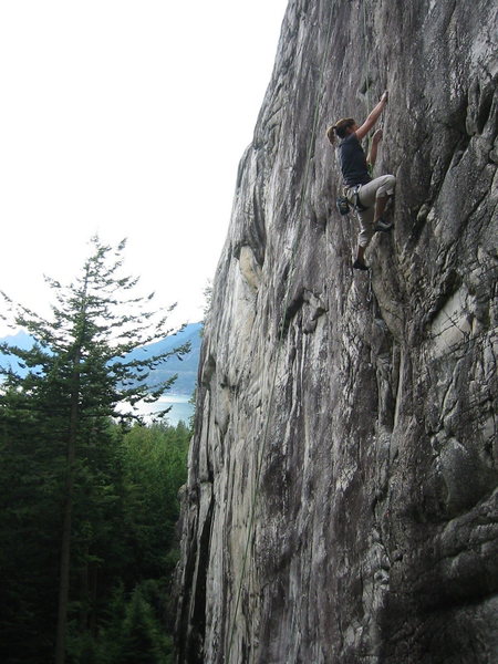 Dana working the moves on The Flingus Cling.  This shot gives a good sense of the height and vertical nature of The Petrifying Wall; looking south we see the lower tier of the wall, with Howe Sound in the distance.