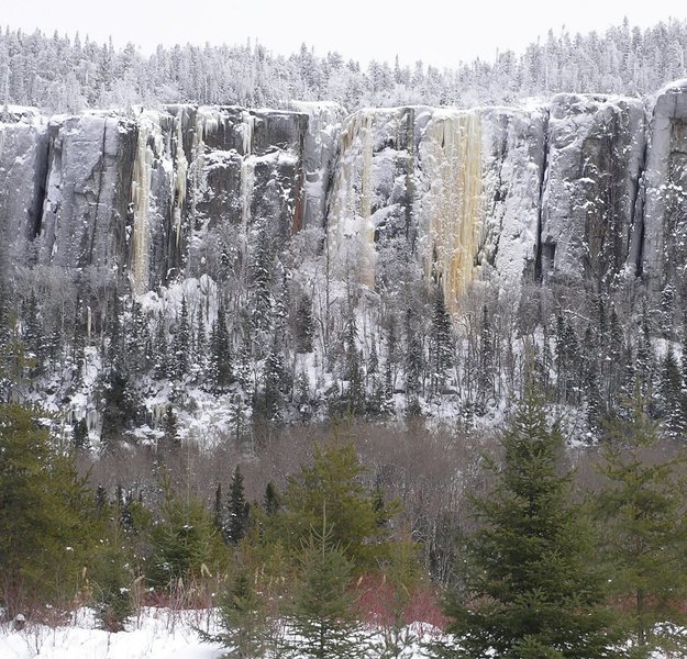 Icebreakers area from the Domtar road. Icebreakers is the massive sheet of ice on the right. To the left are: Kama Bay Cakewalk, Icebreakers Arete, Thermocules (deep, hidden chimney), and furthest left is Whimpsickle.
