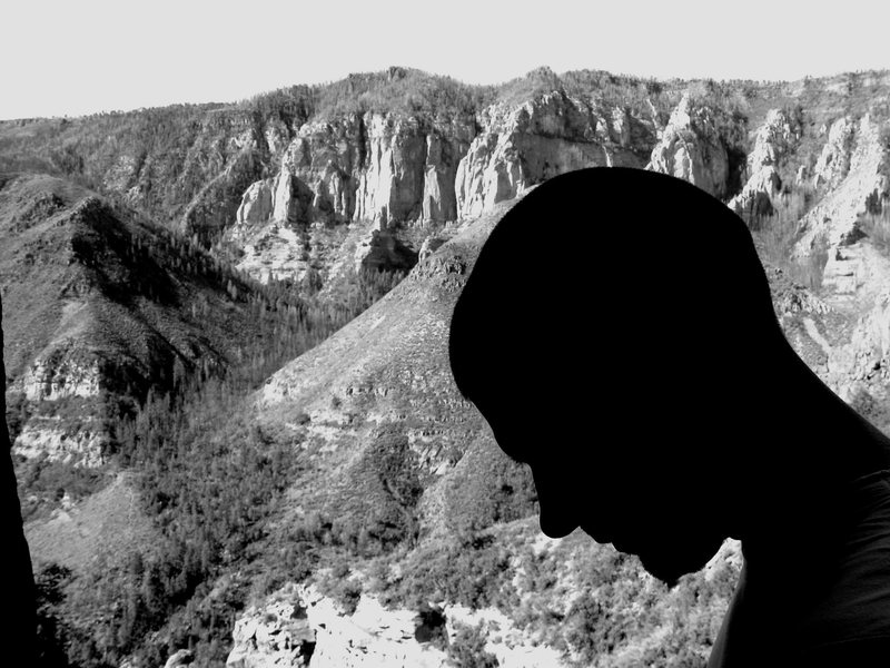 Mug profile of Wade Forrest on the Labor Day belay ledge, waterfall area, overlooking part of Oak Creek Canyon