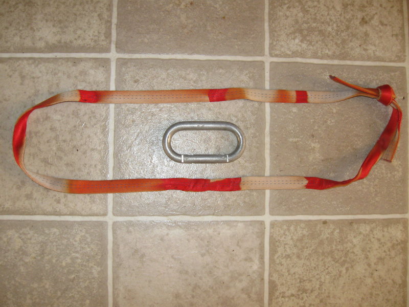 As far as I know, this is the last bit of true oldschool tat to be taken down from the Waterfall. Found on the next column right of the Labor Day belay ledge. This single piece of webbing was threaded through 2 old #3 stoppers. The single SMC biner has RJ stamped upon it. Any Ideas?