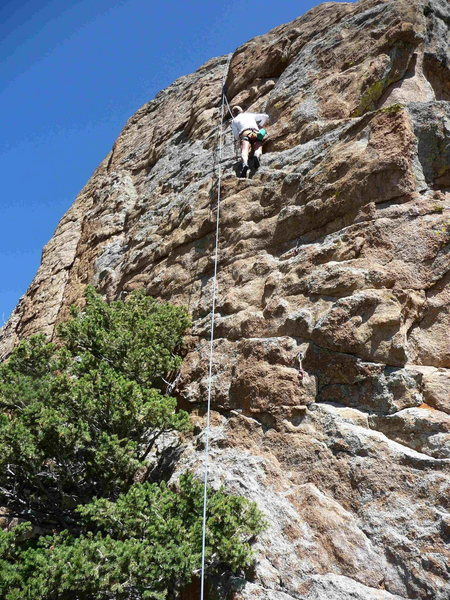 Cindy Martinson top-roping up Byrontosaurus, just above the crux.