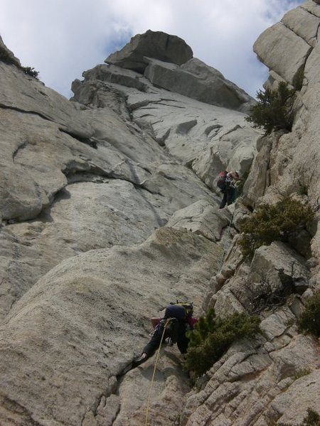 Climbing pitch 6. The huge roofs above are avoided by climbing to the left on pitch 11, and pitch 12 starts above them.