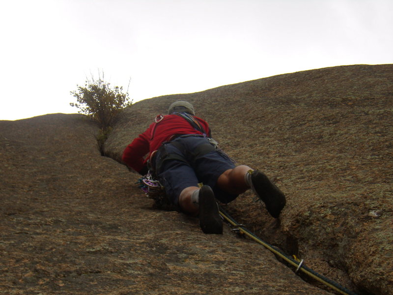 Mike heading up a steep bit on pitch three, about to to a little battle pruning.
