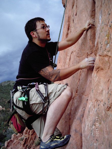 John cranking the climb quickly before the storm.