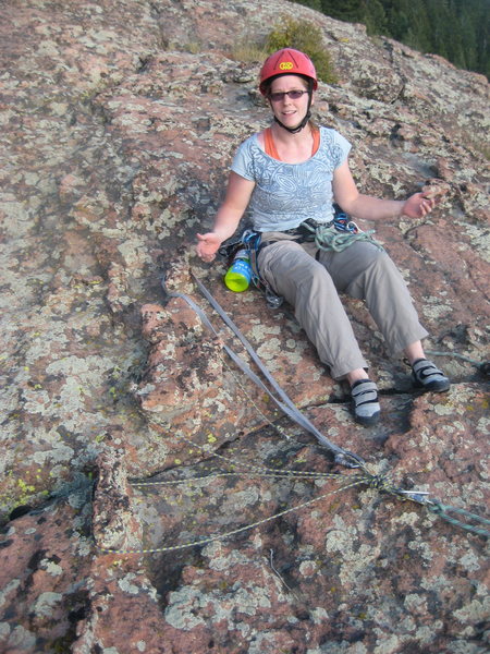 Alyce Smith examines my handy Chicken Head Anchor on the FA of Tradventure (5.9) in Devils Head, CO.