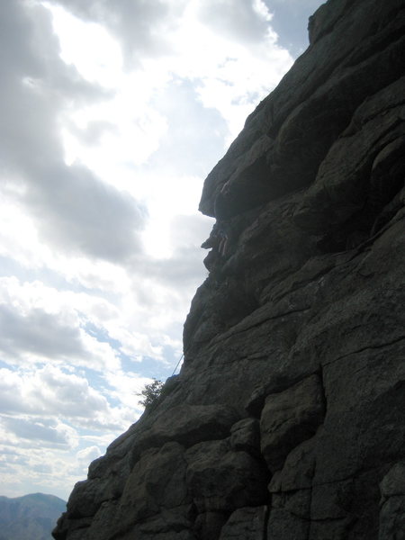Chris Perkins on the FA of "First Blood" (5.9) at Devil's Head, CO.  Photo Taken by Suzanne Lane.