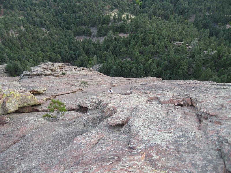 Looking down the east face of the First Flatiron. Unknown solo climber coming up.