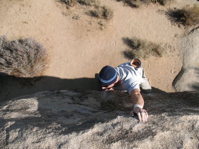 Reaching for the top of Joker (V1), Joshua Tree NP