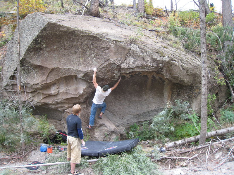 Climbers developing the large scooped-out boulder just downstream from Knob Goblin Boulder.