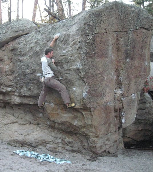 Clinging to the slopers on <em>The Donkey Punch.</em>